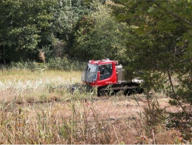 Mowing cutter head on WHAMM Program Pisten Bully 100 AS Flail Mower.